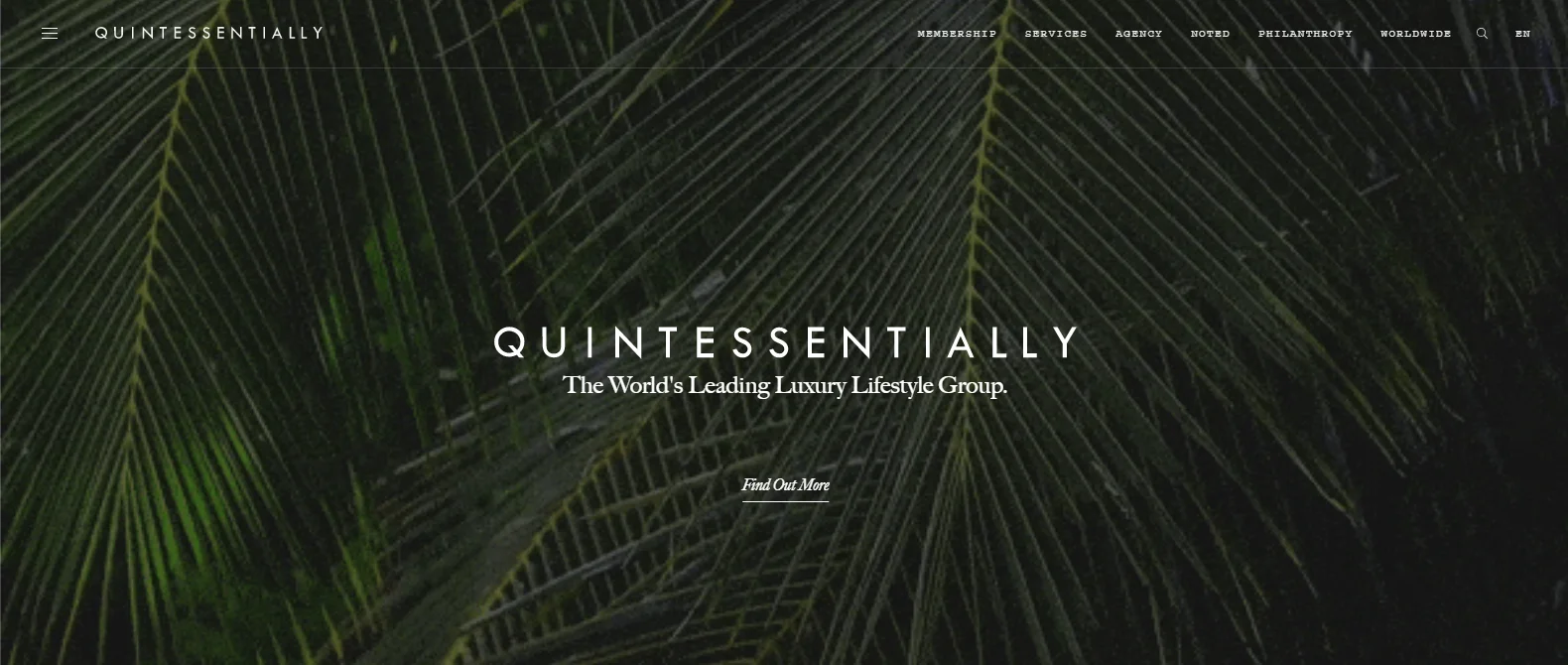 A website homepage featuring a backdrop of lush green palm leaves. At the center, it proudly states, QUINTESSENTIALLY The Worlds Leading Luxury Lifestyle Group, showcasing their success as a premier concierge company. A call-to-action button below invites you to Find Out More.